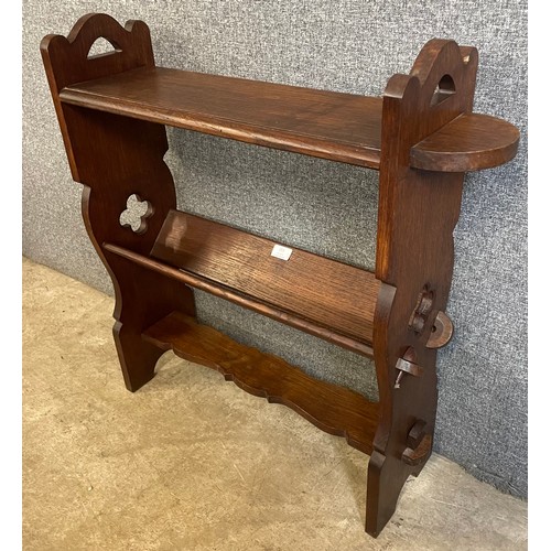 153 - An Arts and Crafts oak bookrack