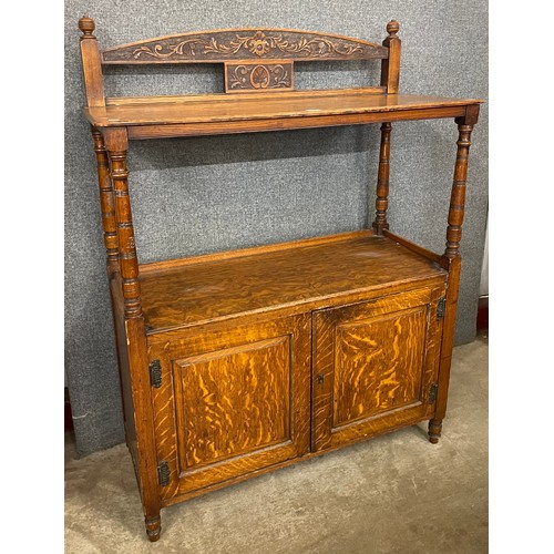 160 - A Victorian Aesthetic Movement carved oak buffet sideboard