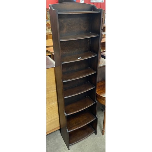 166 - A tall oak open waterfall front bookcase