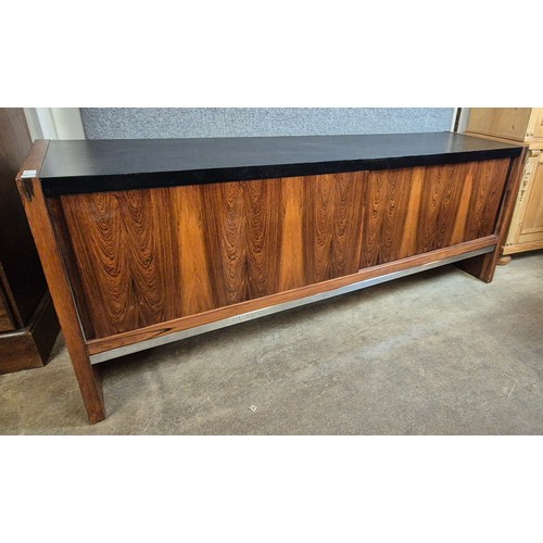 100 - A Merrow Associates rosewood, chrome and black vinyl topped sideboard. CITES A10 no. 24GBA10N1TEFQ