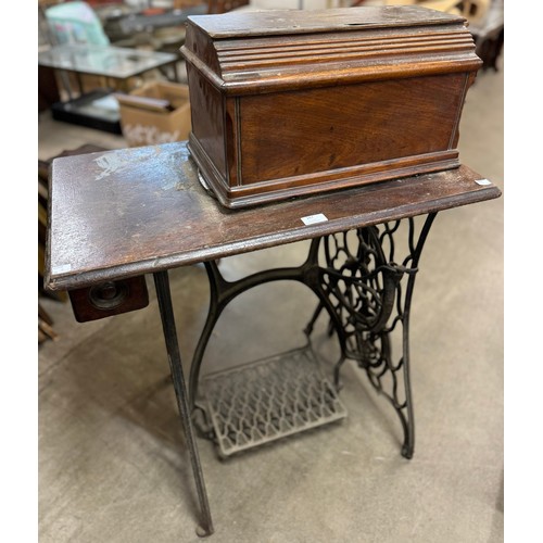 297 - A Singer oak and cast iron sewing table