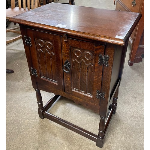 168 - A small 17th Century style carved oak two door cupboard