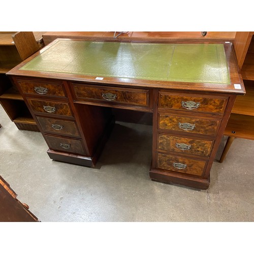 154 - A Victorian oak, walnut and green leather topped pedestal desk