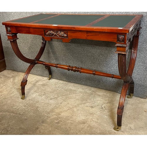137 - A 19th Century style French mahogany and green leather topped writing table