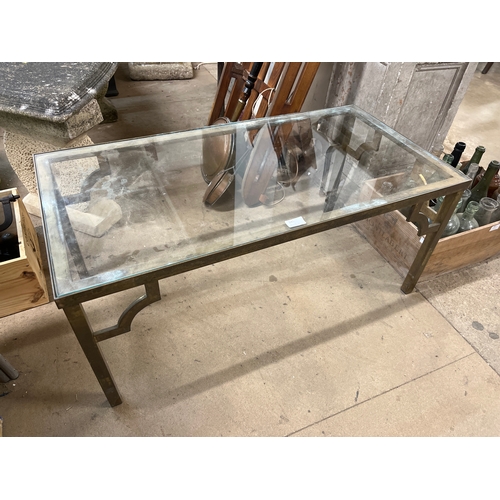 345 - A brass and glass topped coffee table