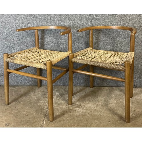 13 - A pair of Danish style beech and cord seated wishbone chairs