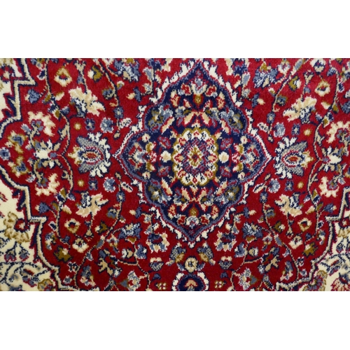 1375 - A rich red ground cashmere rug (95x130cm)