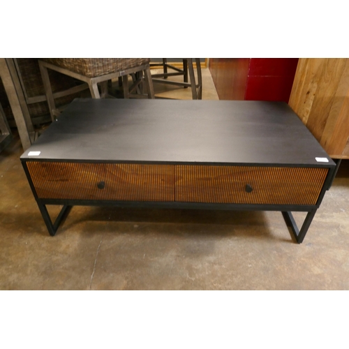 1386 - A black and grooved hardwood coffee table  *This lot is subject to VAT