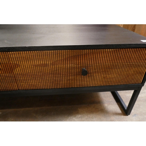 1386 - A black and grooved hardwood coffee table  *This lot is subject to VAT