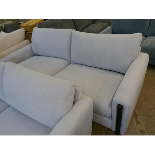 1401 - A sky blue upholstered four seater sofa and three seater sofa on a semi exposed frame RRP £2824