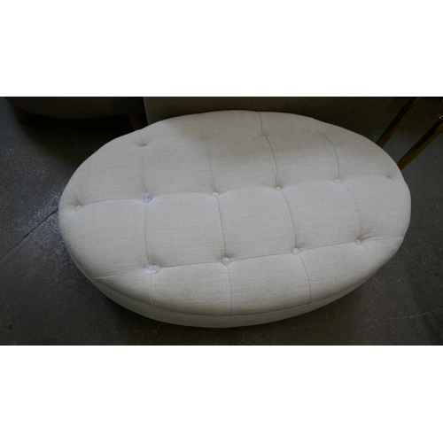 1410 - An oval ivory upholstered footstool