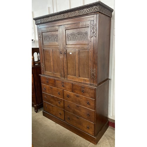 101 - A 17th Century and later carved oak linen press