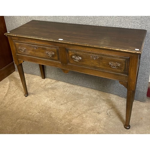 133 - A George II style oak two drawer dresser