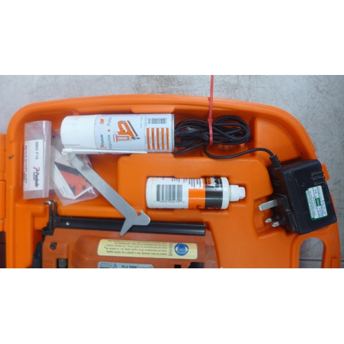 2001 - A Paslode Impulse IM65 F16 second fix nail gun with charger, battery and safety glasses and a quanti... 