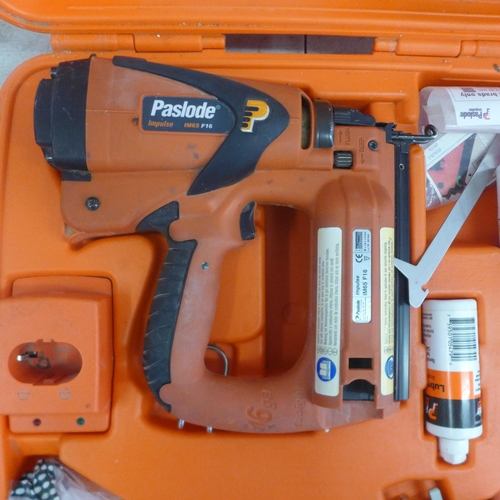 2001 - A Paslode Impulse IM65 F16 second fix nail gun with charger, battery and safety glasses and a quanti... 