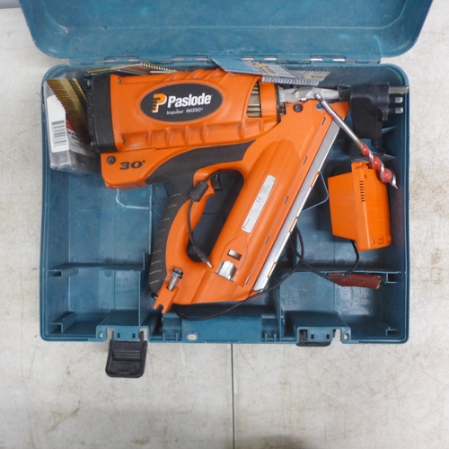 2027 - A Paslode Impulse IM350+ cordless nailer with Paslode automotive power adapter, charger and a quanti... 