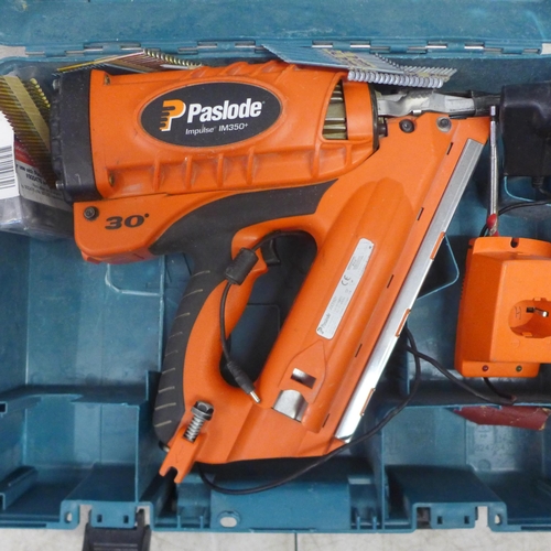 2027 - A Paslode Impulse IM350+ cordless nailer with Paslode automotive power adapter, charger and a quanti... 