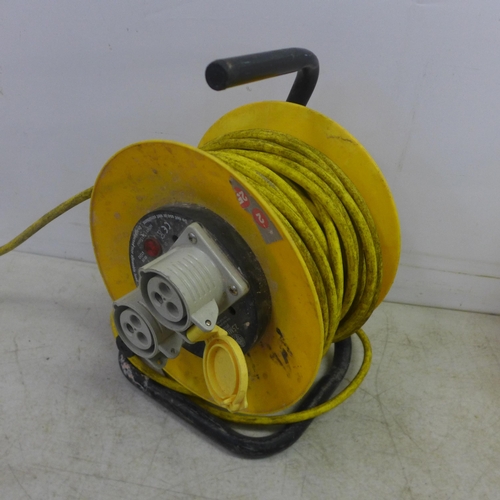 2031 - A Carroll Maynell 100-130V transformer with dual 16A outlet sockets and a Jo Jo 25m, 110V, 16A, 25m ... 