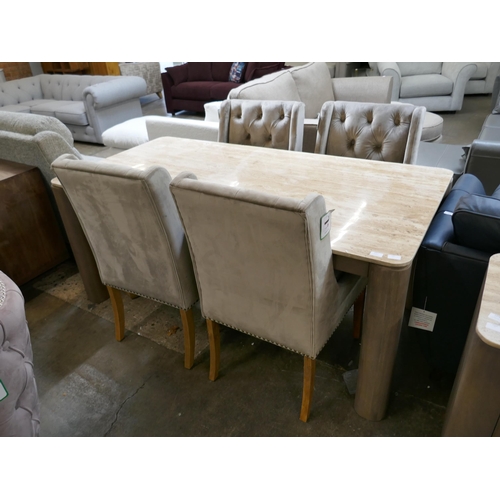 1452 - A Travertine dining table and four mink buttoned chairs  *This lot is subject to VAT