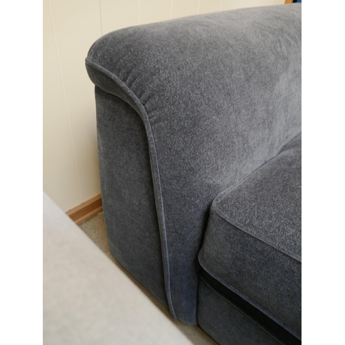 1459 - A deep blue upholstered three seater sofa
