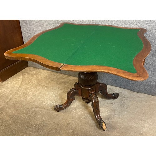 156 - A Victorian walnut and burr walnut serpentine fold over games table