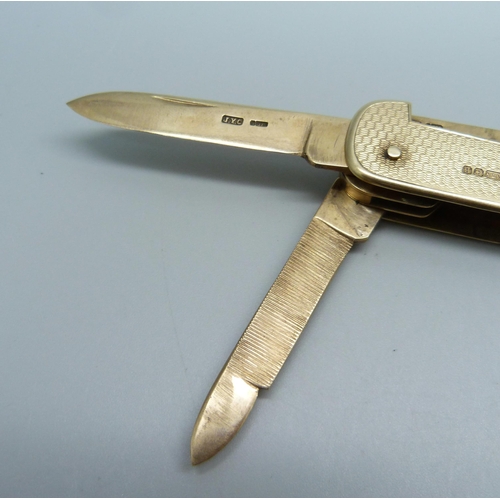 1003 - A fully hallmarked 9ct gold pocket knife, Birmingham 1926, by J.Y. Cowlishaw, one blade bears inscri... 