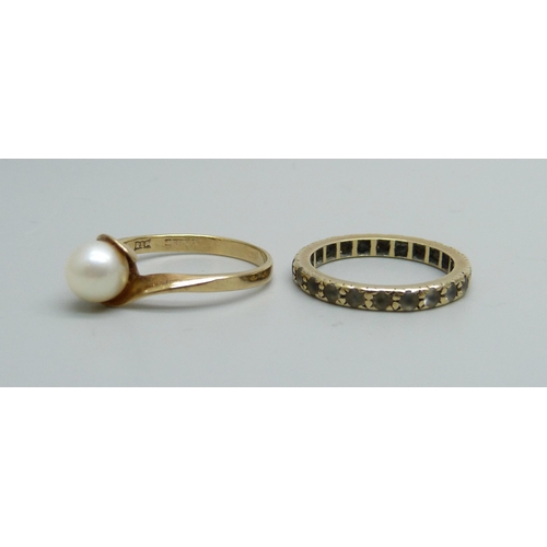 1017 - A 9ct gold and pearl ring and a 9ct gold ring marked Sym Spinel, 3.7g, N and K