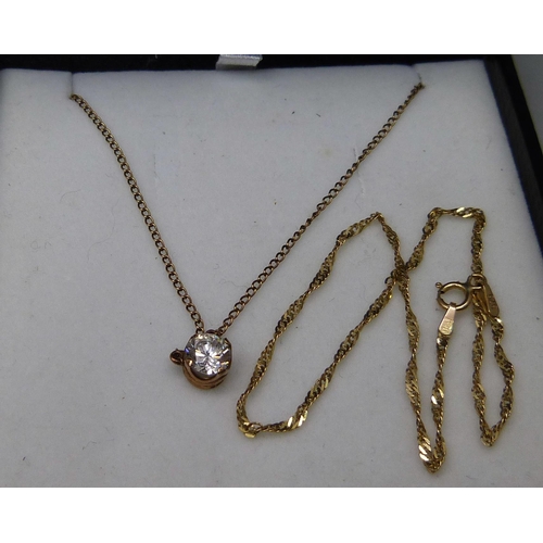 1024 - A 9ct gold bracelet, a 9ct gold stone set pendant and chain, two pairs of 9ct gold earrings and a pa... 