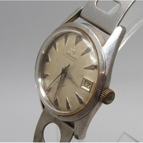 1026 - A Nivada Compensamatic wristwatch, with sweep second hand and date