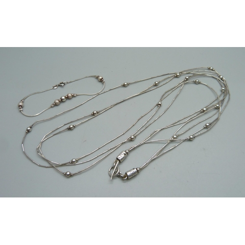 1048 - A liquid silver style necklace, the clasp marked 925, and a silver bracelet, 14g