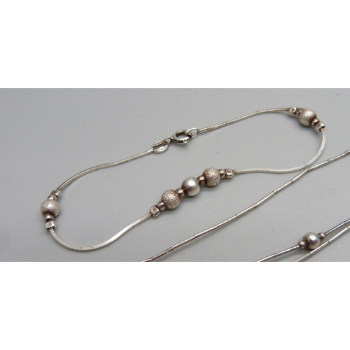 1048 - A liquid silver style necklace, the clasp marked 925, and a silver bracelet, 14g