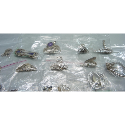 1057 - Twenty-five silver and white metal pendants and chains