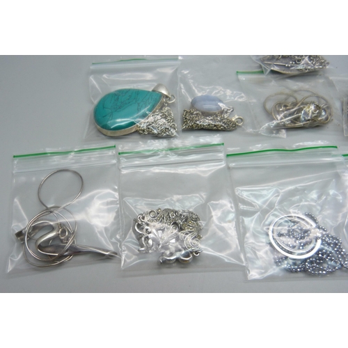 1073 - Twelve silver pendants and chains