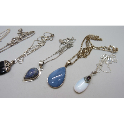 1076 - Six silver pendants and chains