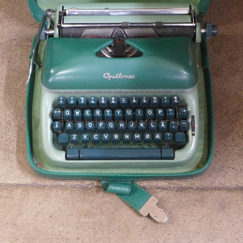 1098 - A cased Optima green typewriter, Hering toy piano and Paul Daniels Magic set **PLEASE NOTE THIS LOT ... 