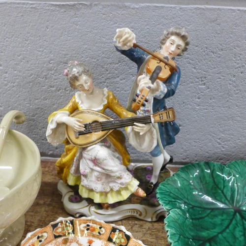 1104 - A Neopolitan figure of musicians, Coalport cup and saucer, Wedgwood cabbage leaf dish and other mixe... 