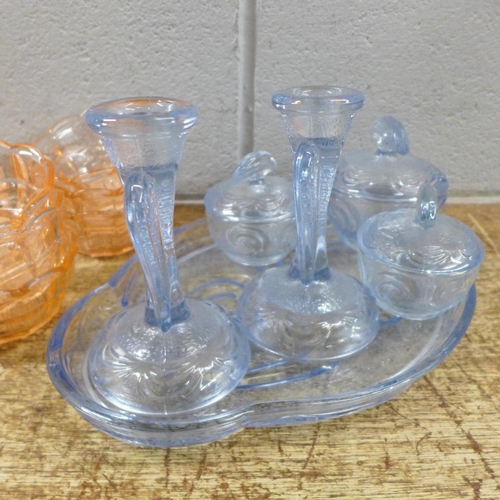 1118 - A peach glass dressing table set, six peach glass bowls and saucers and a pale blue glass dressing t... 