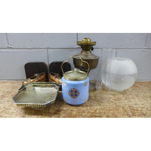 1128 - An Art Deco style biscuit barrel, a plated footed sweetmeat dish, a pair of bookends and an oil lamp... 