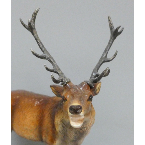 611 - A Beswick red stag, one antler repaired