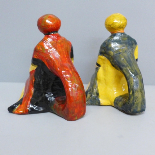 630 - A pair of 1920s figural napkin holders, 11cm
