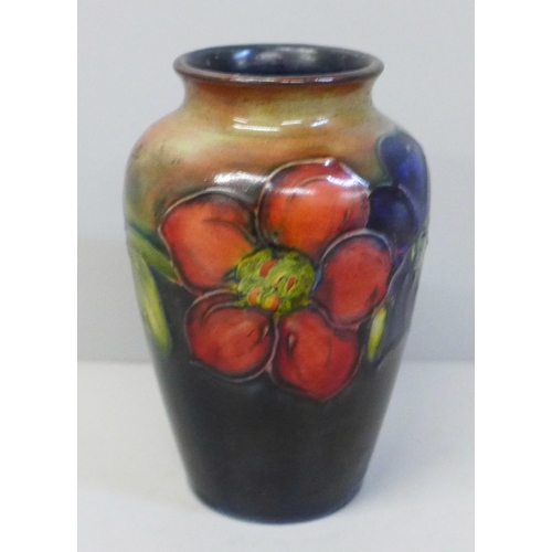 647 - An early 20th Century Moorcroft vase, possibly rim restored, 11cm