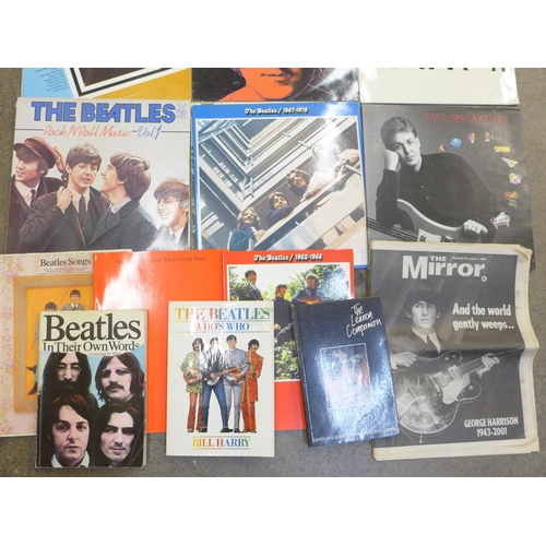 674 - Twelve The Beatles/Beatles solo LPs, several books and newspaper from 2001