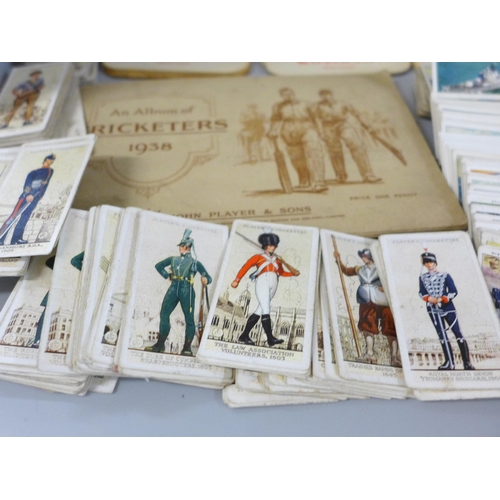 688 - A box of cigarette cards, other trade cards including A&BC Western cards, Tarzan & the She-Devil car... 