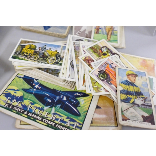 688 - A box of cigarette cards, other trade cards including A&BC Western cards, Tarzan & the She-Devil car... 