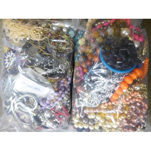 710 - Two bags of costume jewellery