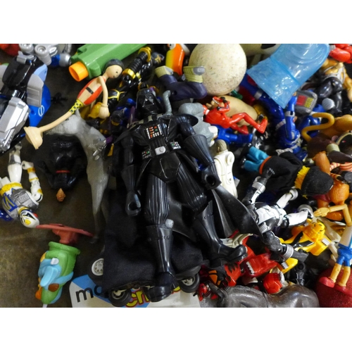 711 - A bag of various Transformer and other similar plastic toys