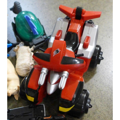 711 - A bag of various Transformer and other similar plastic toys