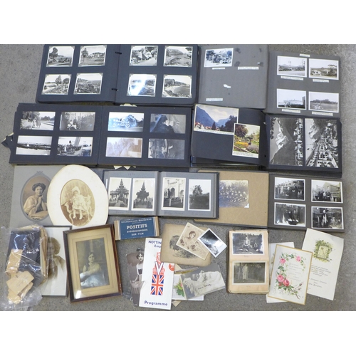 728 - A collection of early 20th Century family photographs, also some later postcards, mainly in albums w... 