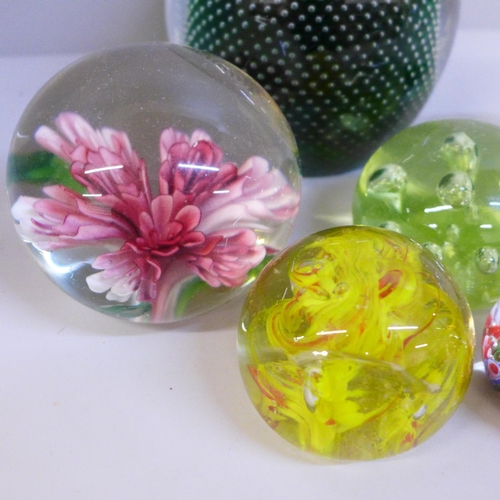 736 - Seven glass paperweights