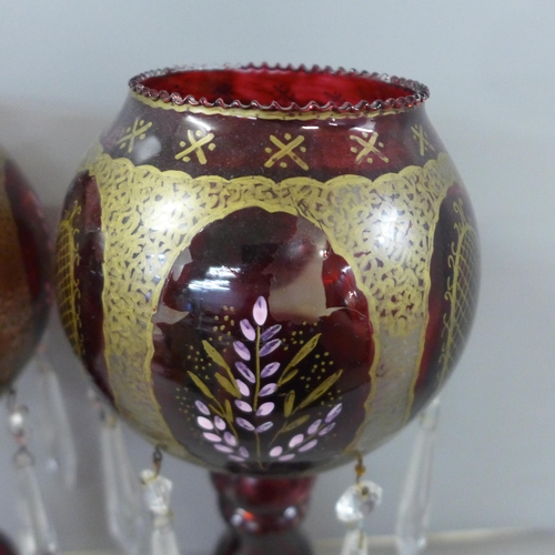 811 - A pair of ruby glass lustres **PLEASE NOTE THIS LOT IS NOT ELIGIBLE FOR IN-HOUSE POSTING AND PACKING... 
